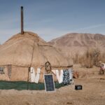 woman going in yurt in steppe