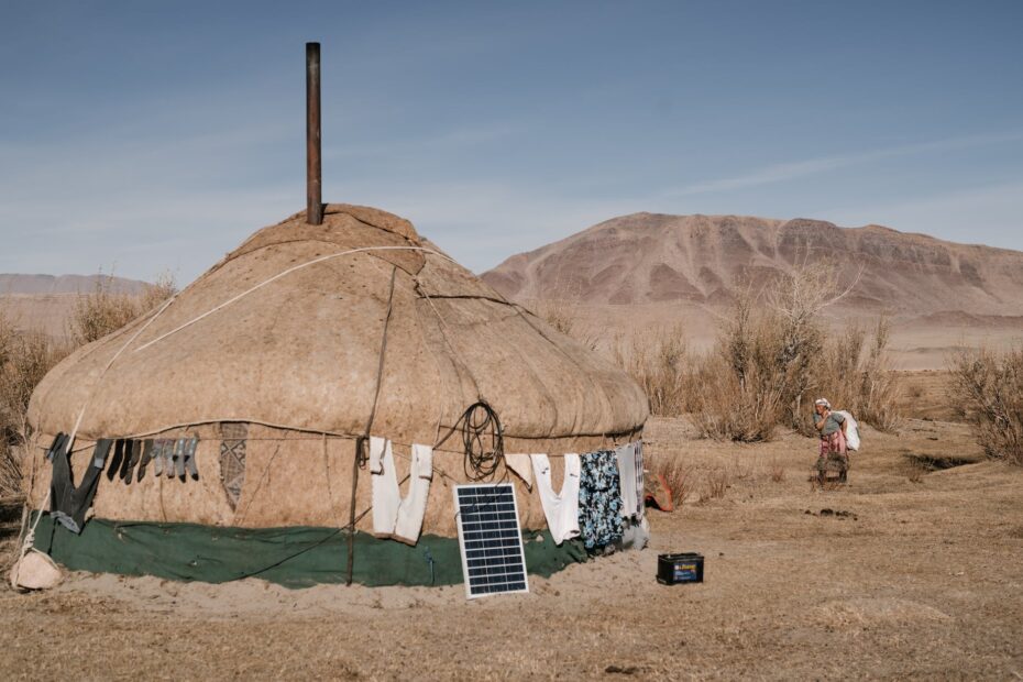 woman going in yurt in steppe